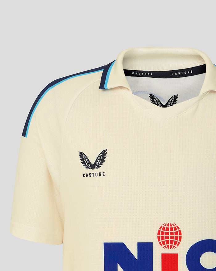 Cream jersey close up of shoulder and collar featuring Yorkshire CCC crest on chest and blue piping along the shoulder