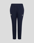 Navy track pants with a white Castore logo on the right thigh and a flower emblem on the left thigh