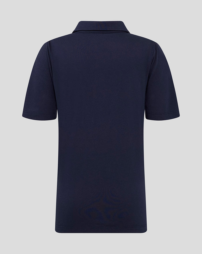 Back view of navy juniors polo with classic collar and Castore label at the neckline.