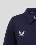 Close up of left chest logo on navy polo showing Castore wings and CASTORE text.