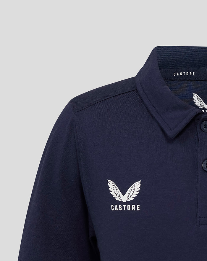 Close up of left chest logo on navy polo showing Castore wings and CASTORE text.