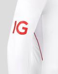 Close-up of white sleeve with bold red IG lettering on the upper arm.