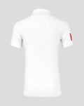 Back view of white cricket polo with collar and small logo at the neckline.