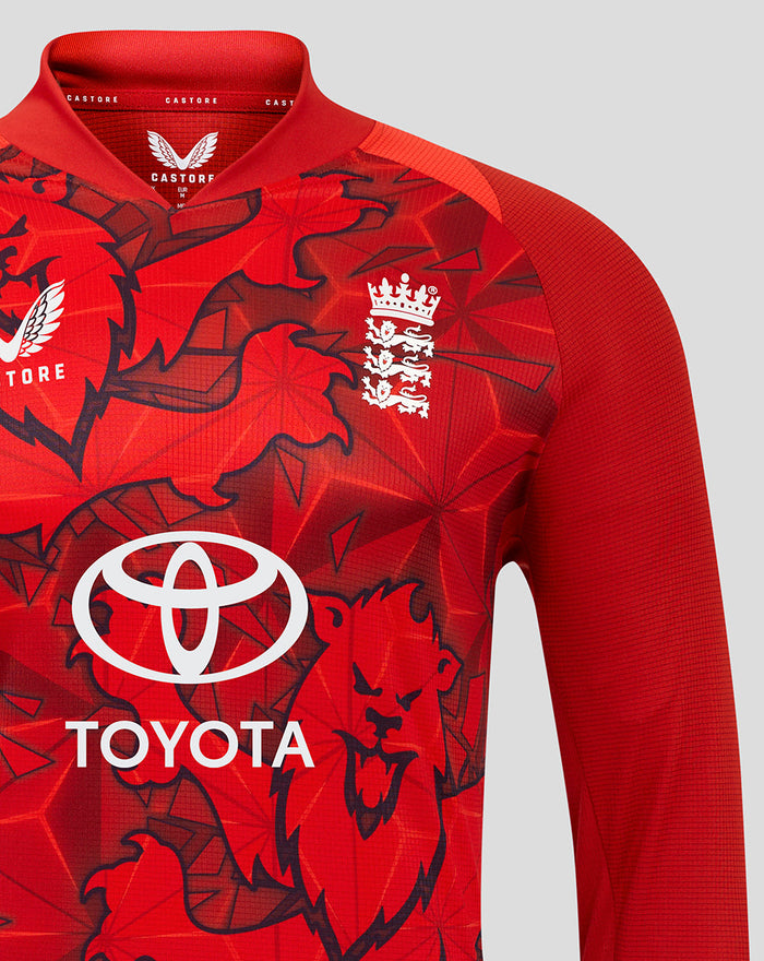 Close up of red T20 Pro shirt showing vibrant graphic print and sponsor logos on chest.