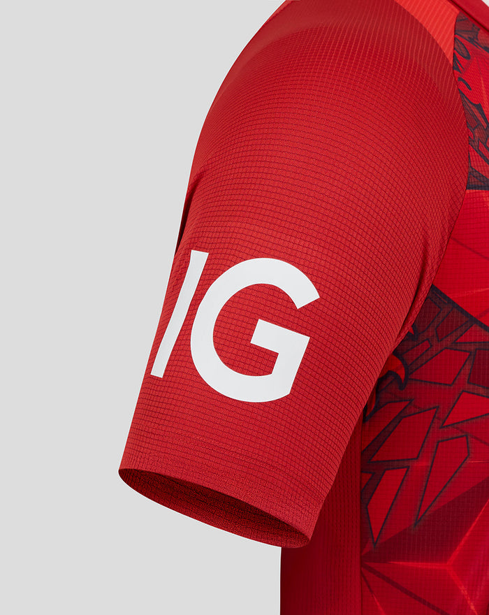 Close-up of sleeve with bold white graphic on red ECB Pro Shirt