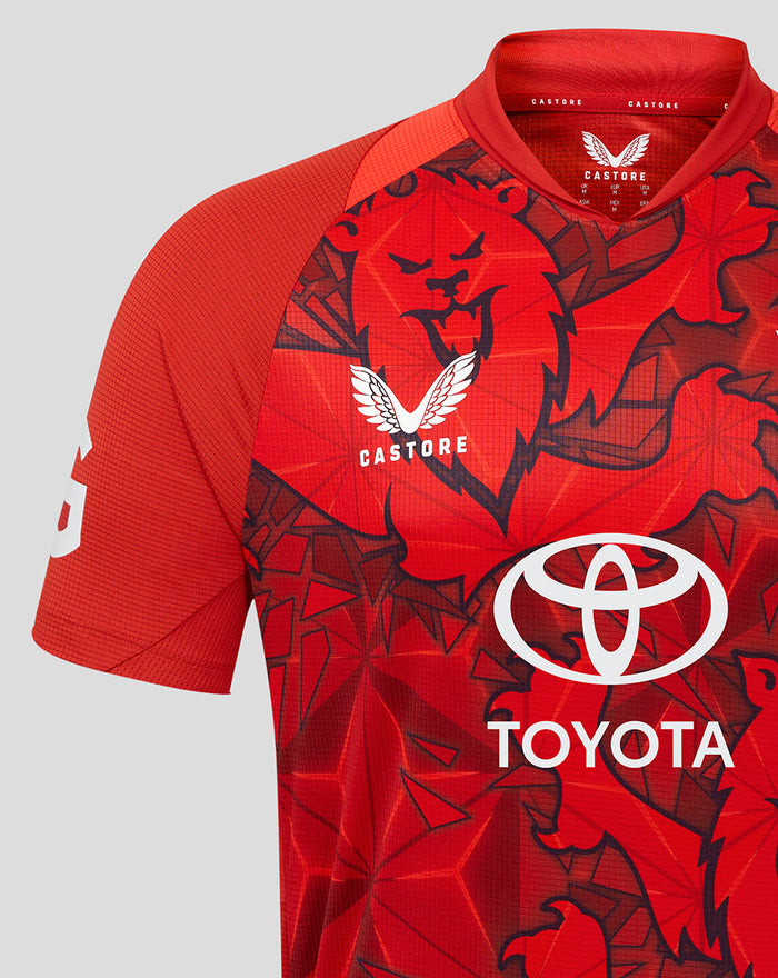 Front view of ECB 25/26 Pro Shirt showing red geometric print and Toyota sponsor across chest