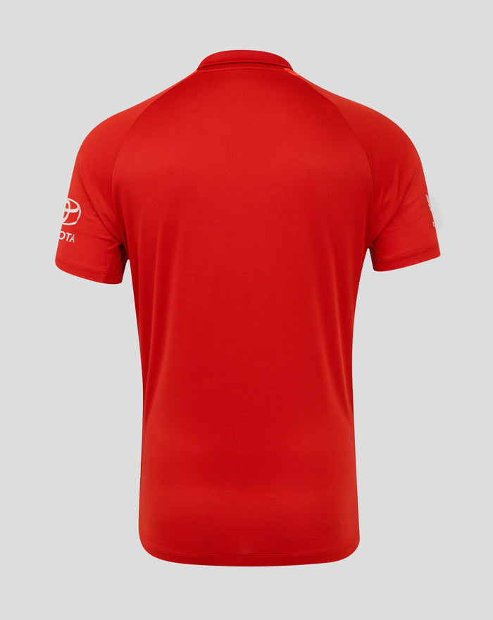 Back view of red replica shirt with textured knit back panel and ribbed collar