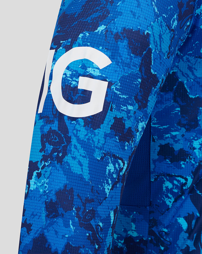 Close up of blue camouflage ECB ODI Pro long sleeve cricket shirt sleeve with bold white graphic
