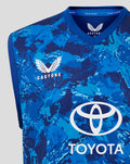 Close-up of the front neckline area showing Castore branding and England crest on the blue camo vest with Toyota logo