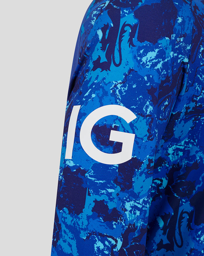 Close up of blue camo ECB Odi Sweater sleeve with bold white lettering