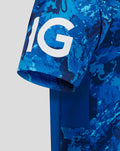 Close-up of blue camouflage ODI shirt sleeve with a large white graphic on the hem