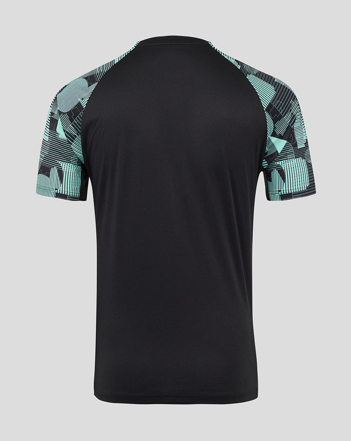 Back view of ECB Men's 25/26 Ashes Pro Training Short Sleeve Tee with black body and teal patterned sleeves.