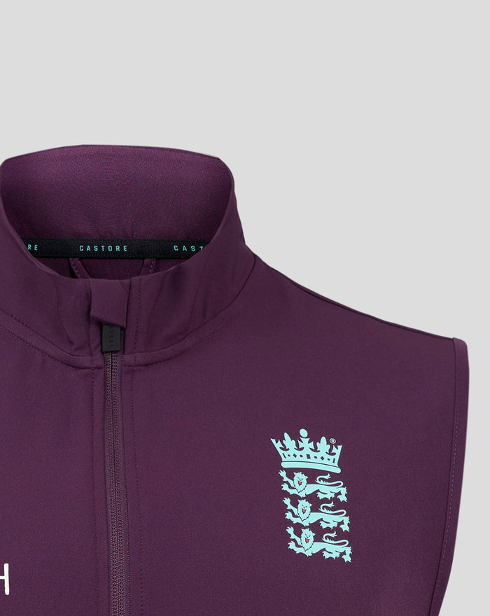 Close up of purple England training gilet with light blue crown crest on the chest.