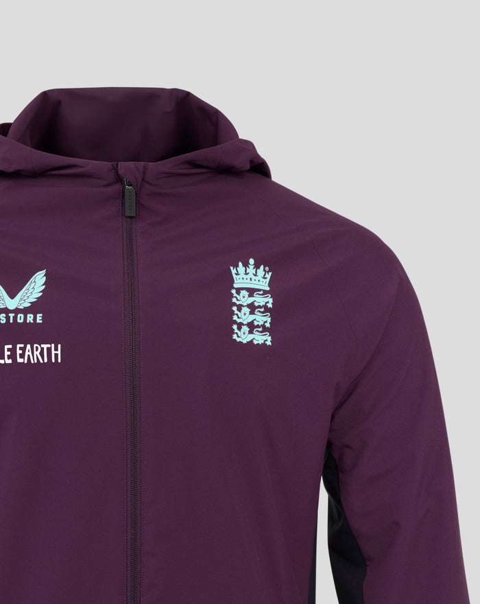 Close-up of the purple jacket collar and zipper with the light blue chest crest visible