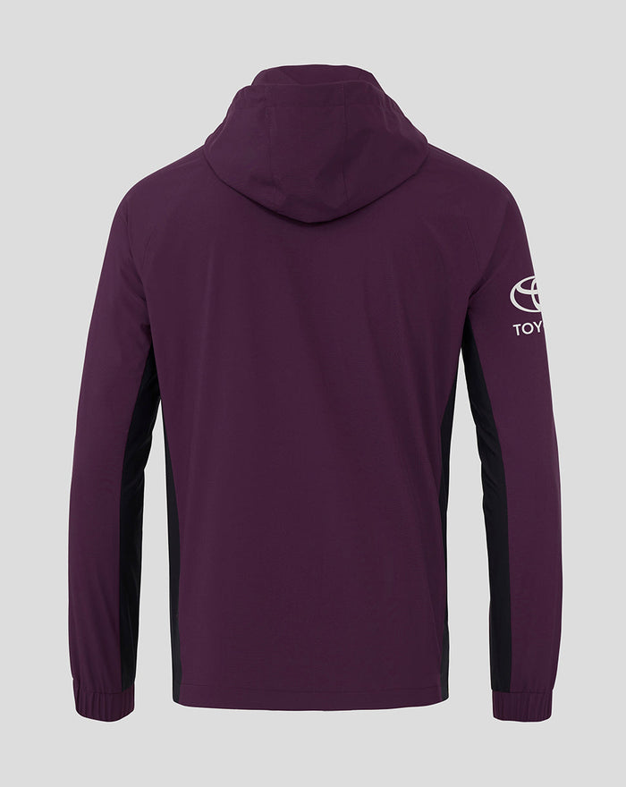 Back view of a purple ECB training rain jacket with a hood and black side panels.
