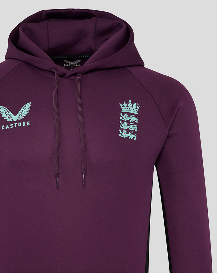 Chest area of purple ECB training hoodie with teal Castore logo on left and England crest on right
