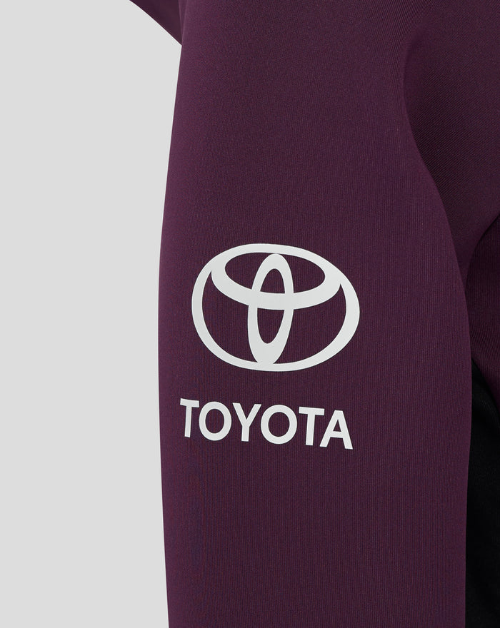 Close up of a purple hoodie sleeve featuring a large white Toyota logo