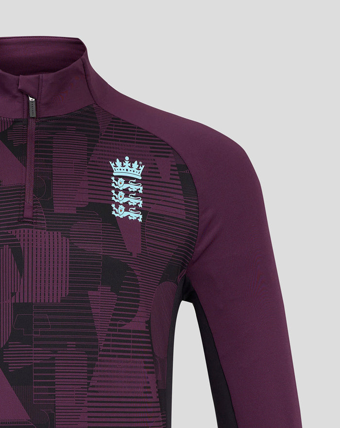 Shoulder and chest close up of the maroon training top with a high collar and quarter zip, showing geometric pattern and light blue England crest.