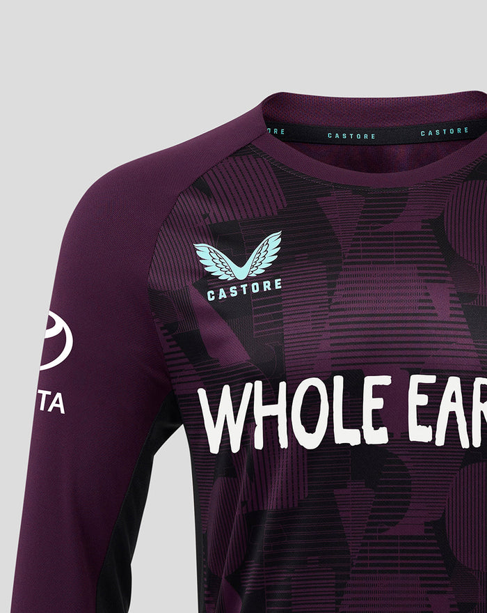 Close up of the purple training shirt showing the light blue England crest and Whole Earth branding on the chest