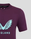 Close-up of purple tee showing pale blue wing emblem and partial ENGLAND lettering at the chest.