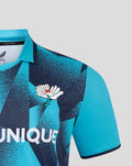 Turquoise Yorkshire T20 men's short sleeve jersey with navy geometric print and white crest