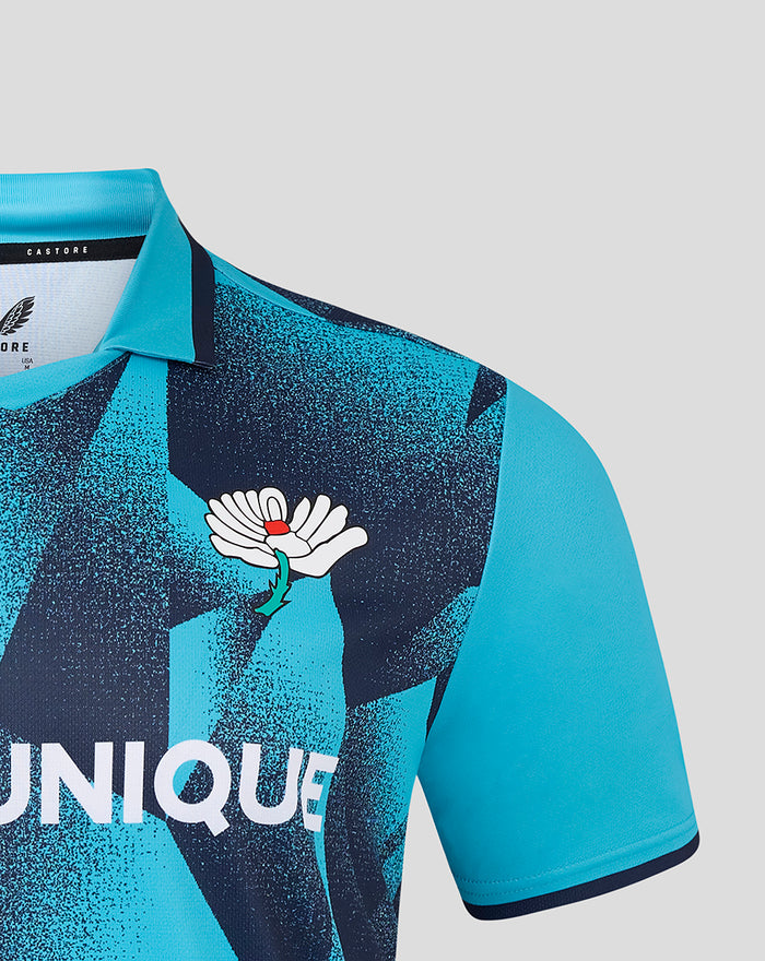 Turquoise Yorkshire T20 men's short sleeve jersey with navy geometric print and white crest