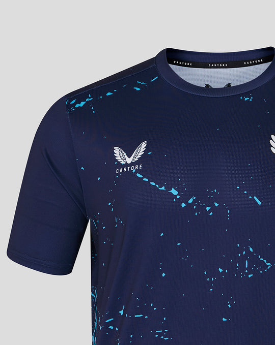 Close up of navy Peacoat T shirt chest featuring White Rose crest and Castore wings with blue splatter.