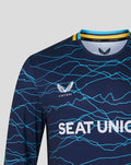 Close-up of navy T20 jersey showing SEAT UNIQUE across chest, white wing crest and blue crack pattern