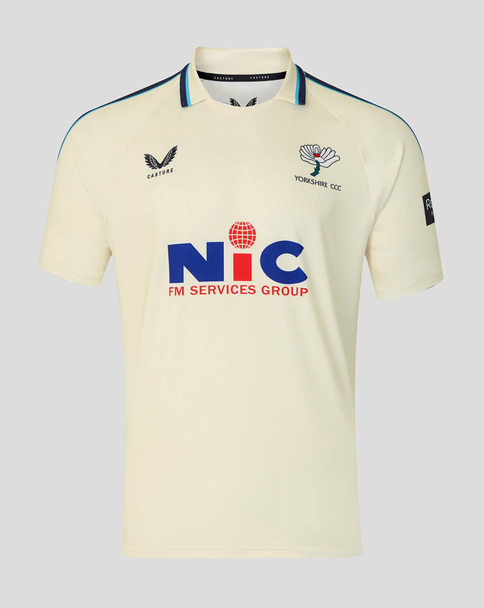 Cream County Championship short sleeve cricket jersey with a classic collar, navy shoulder piping, Yorkshire CCC crest on the left chest and NIC sponsor logo across the front.
