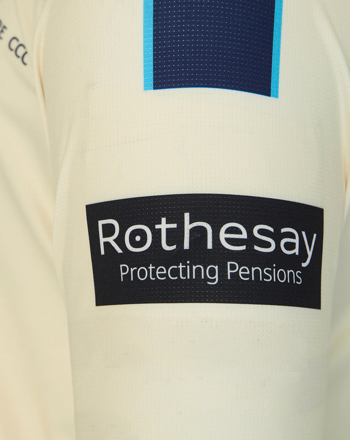 Cream county championship cricket jersey close up showing Rothesay Protecting Pensions sponsor logo and blue navy block on chest