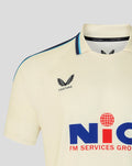 Front close up of cream County Championship jersey showing NIC sponsor logo across the chest and Castore branding on the left chest with navy shoulder piping.