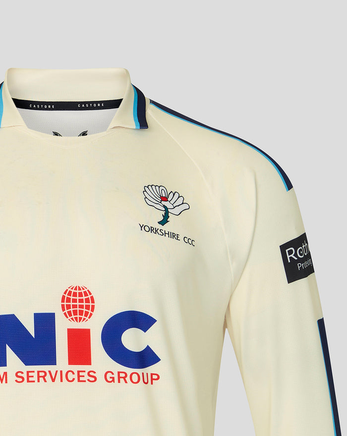 Cream county cricket jersey close-up of chest showing Yorkshire CCC crest and NIC sponsor.