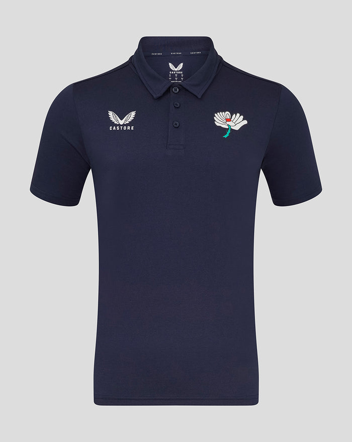 Navy polo shirt with small white wing logo on the left chest and a larger wing crest on the right chest.