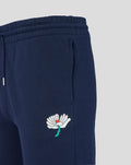Navy joggers close up showing hip area with a white flower logo and turquoise stem.