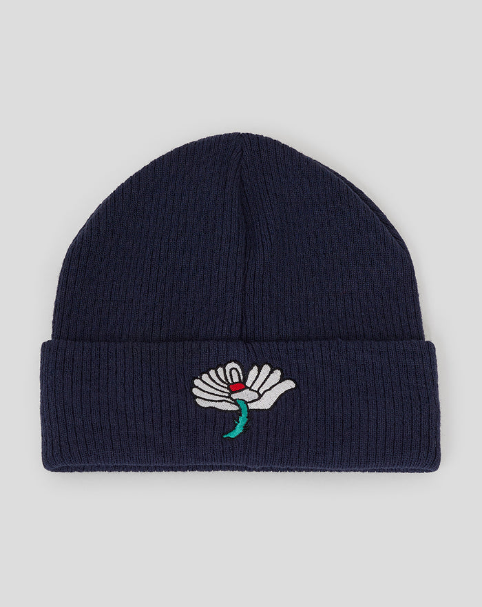 Navy Yorkshire Beanie with folded cuff and white embroidered flower on the front